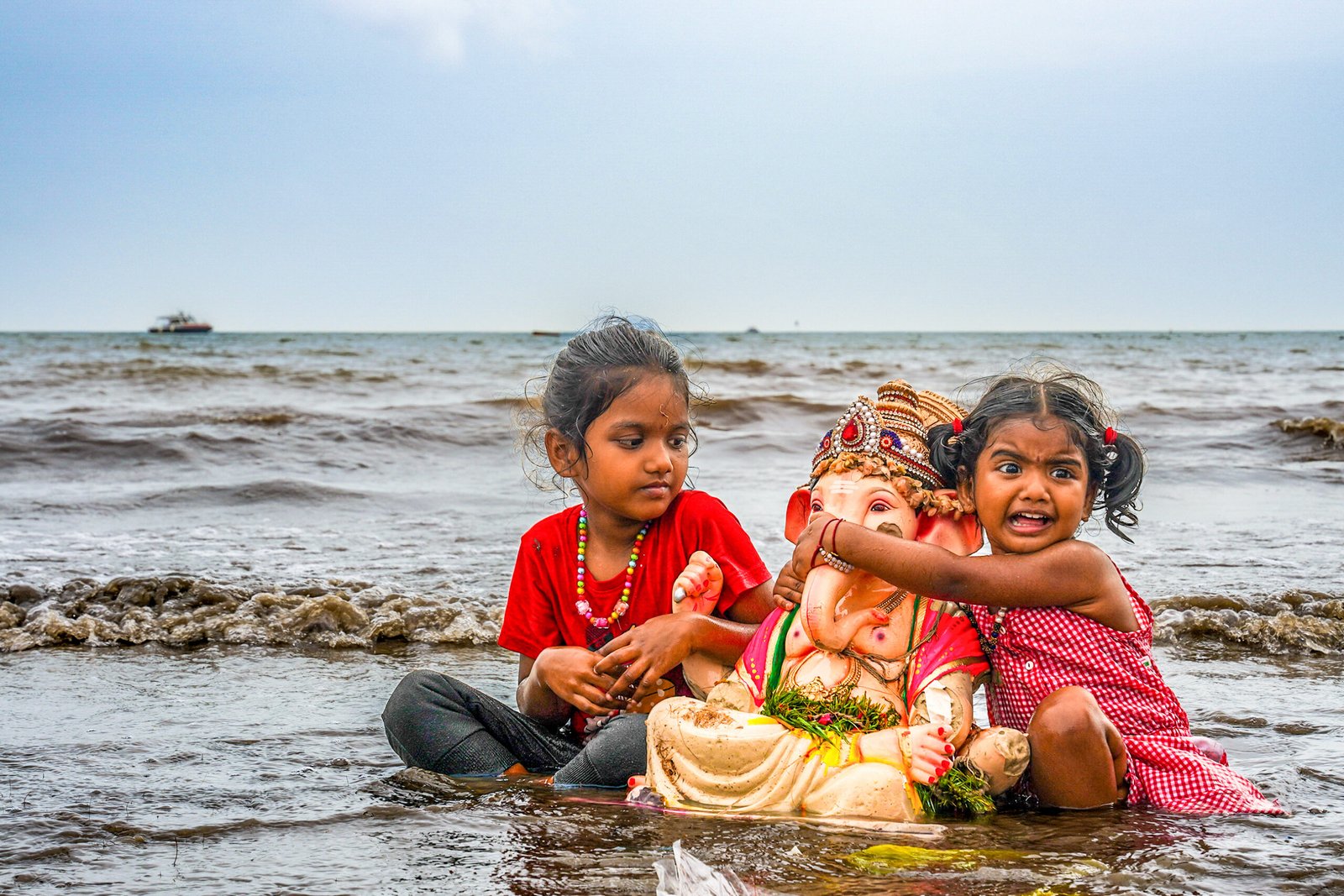 “INNOCENCE IN GANESH IMMERSION” – Girgaon Chowpatty, Mumbai.